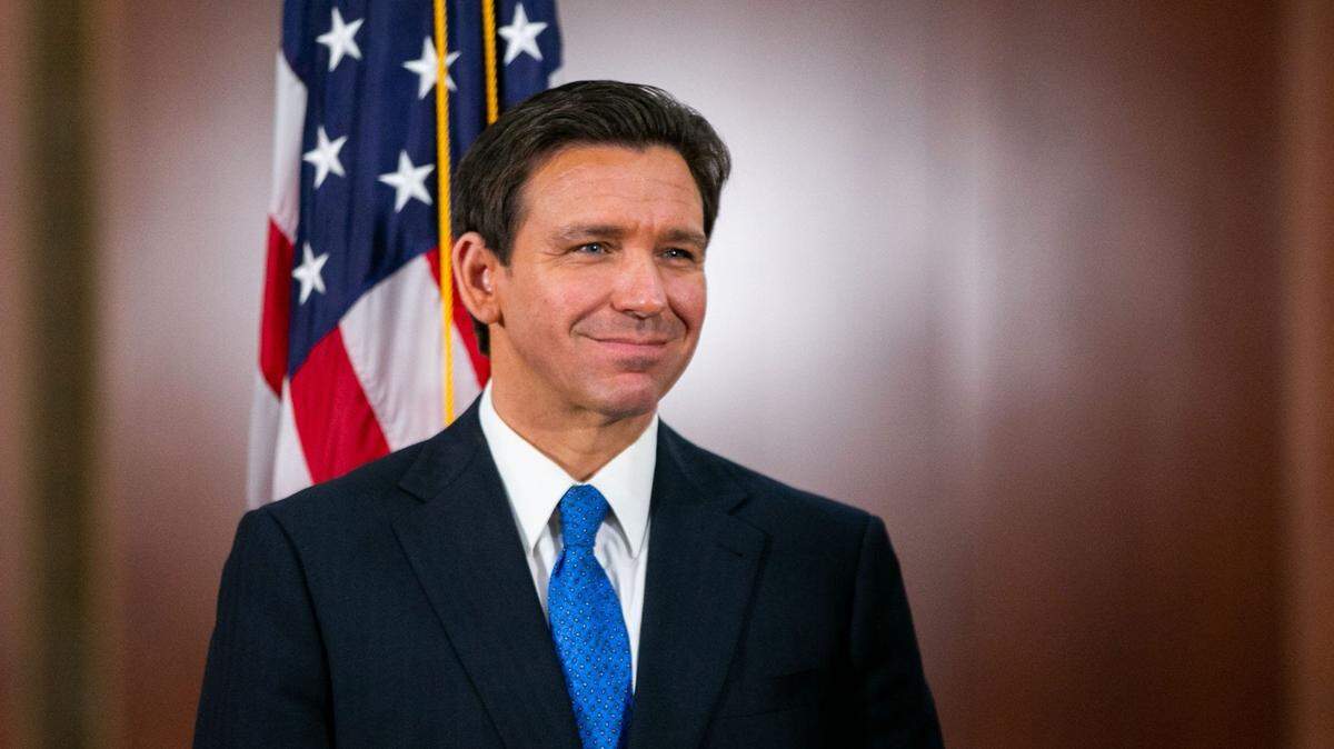 Gov. Ron DeSantis listens to Senate President Kathleen Passidomo speaks during a press conference in the Cabinet room of the Capitol in Tallahassee on Friday, May 5, 2023.