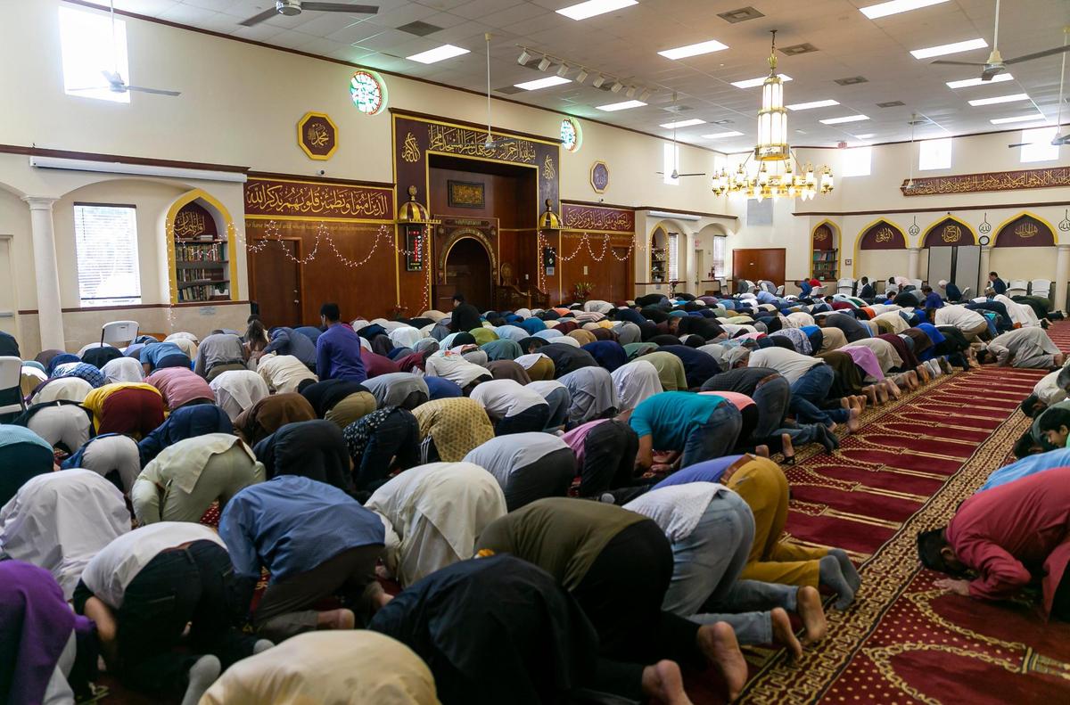 People perform the Eid al-Adha prayer at the Islamic Center of Greater Miami on Saturday, July 9, 2022, in Miami Gardens, Fla.