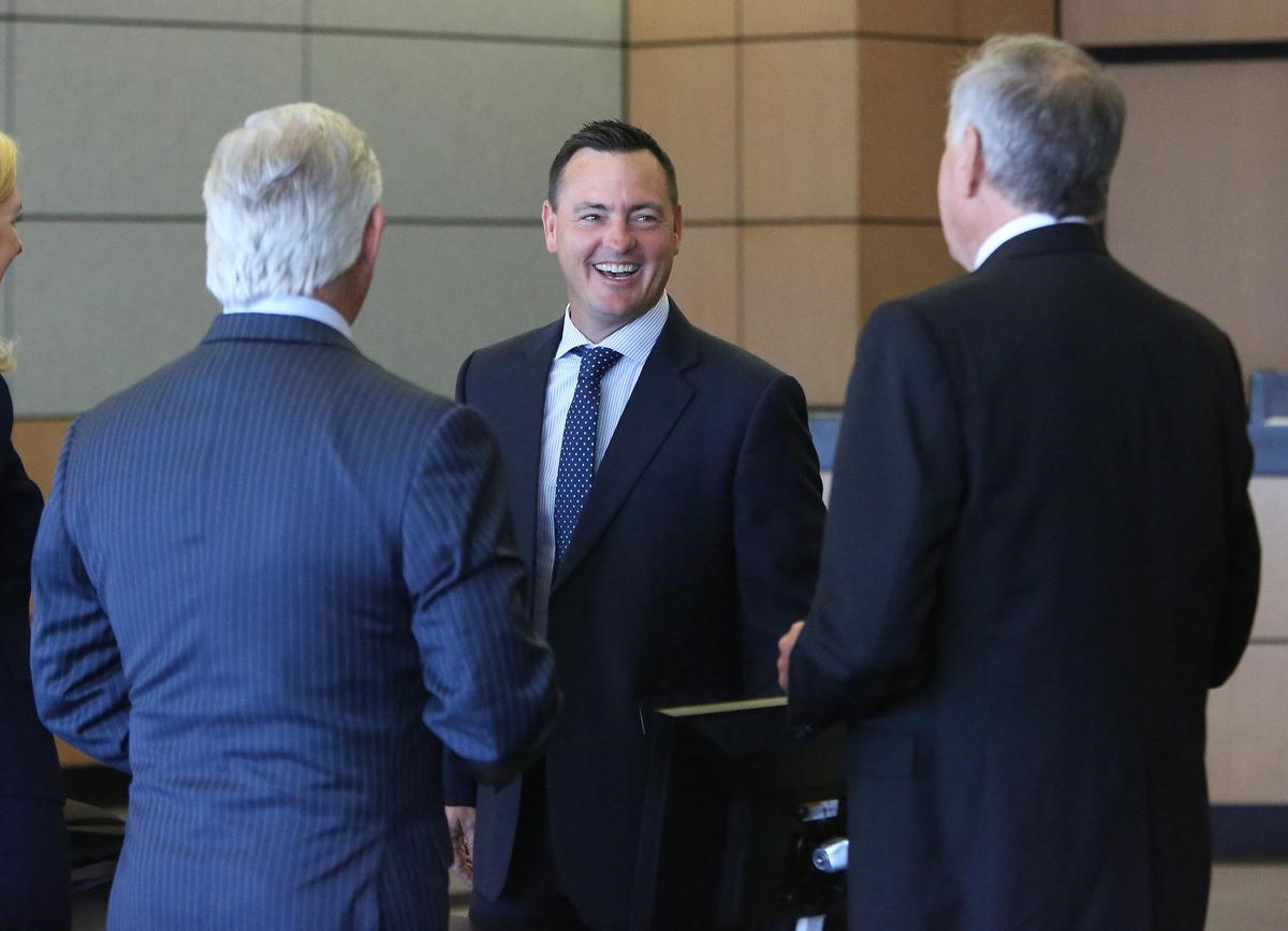 Bradley Edwards, facing the camera, speaks to Jeffrey Epstein attorneys Scott Link and Jack Goldberger prior to a civil settlement announcement in Palm Beach County Court Tuesday, Dec. 4, 2018. Edwards represents some of Epstein’s accusers.