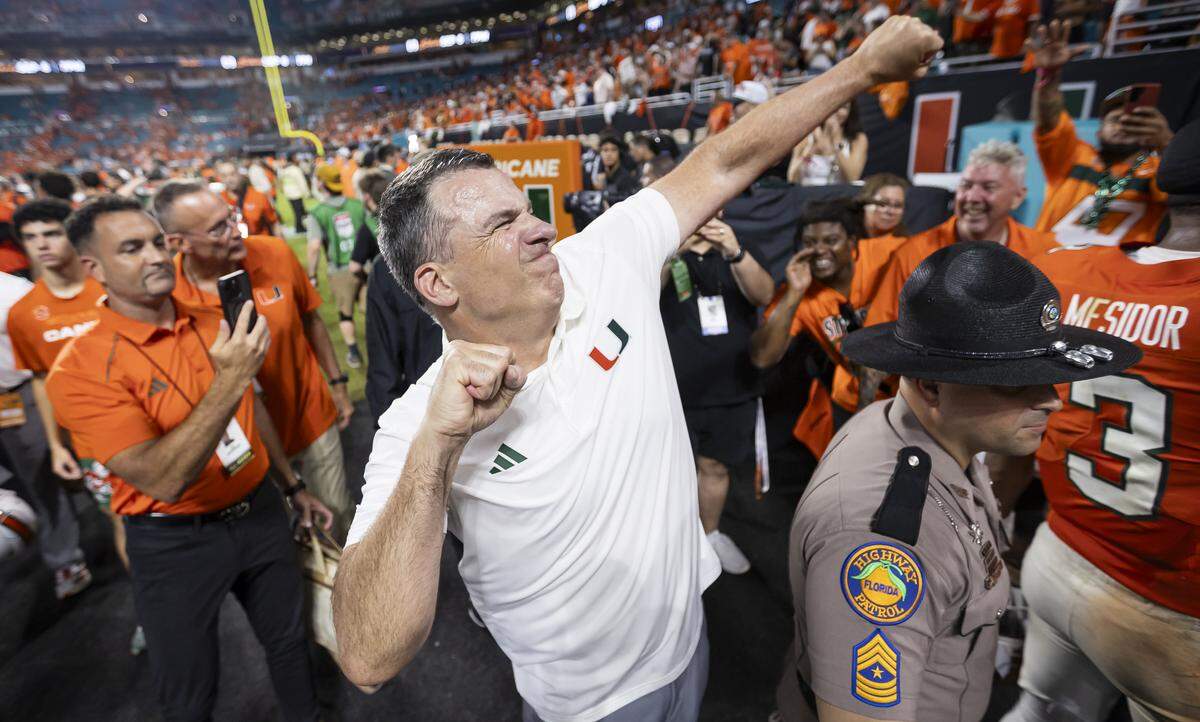 Miami Hurricanes head coach Mario Cristobal celebrates after his team defeated the Notre Dame Fighting Irish in their NCAA football game at Hard Rock Stadium on Sunday, Aug. 31, 2025, in Miami Gardens, Fla.