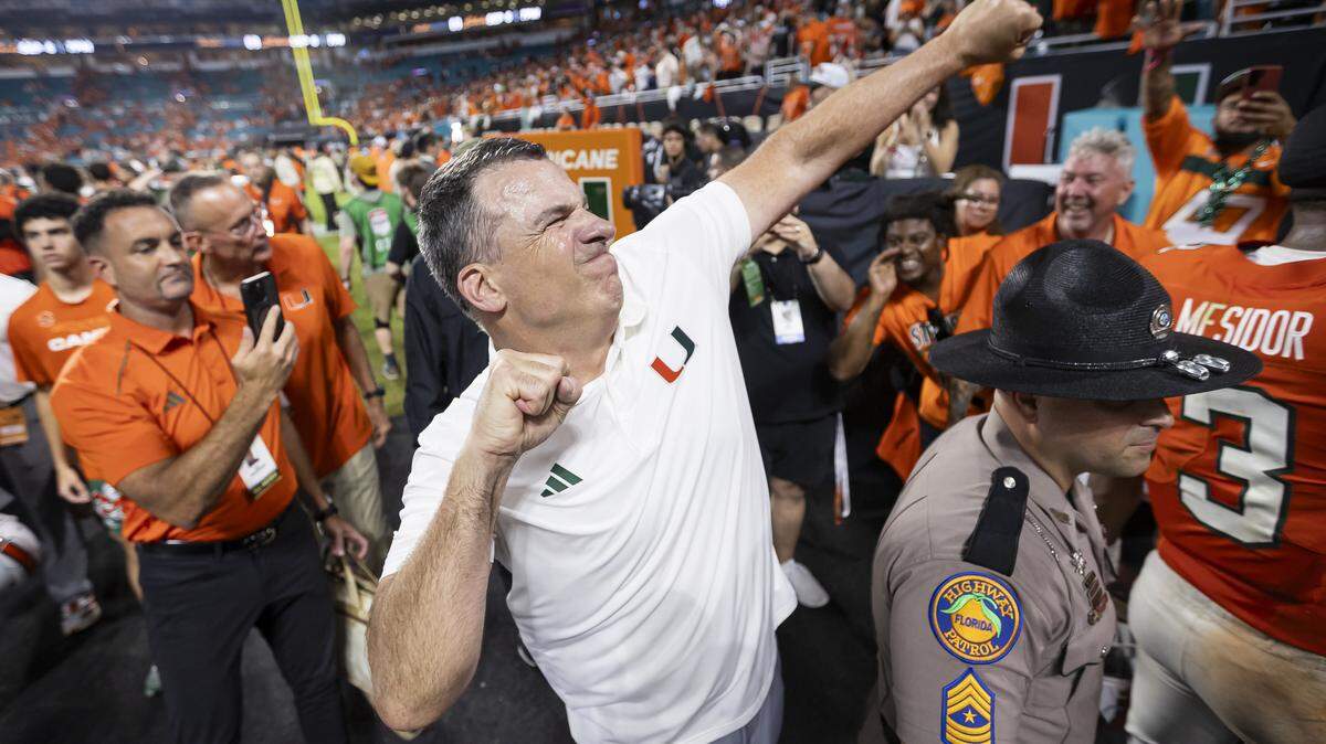 Miami Hurricanes head coach Mario Cristobal celebrates after his team defeated the Notre Dame Fighting Irish in their NCAA football game at Hard Rock Stadium on Sunday, Aug. 31, 2025, in Miami Gardens, Fla.