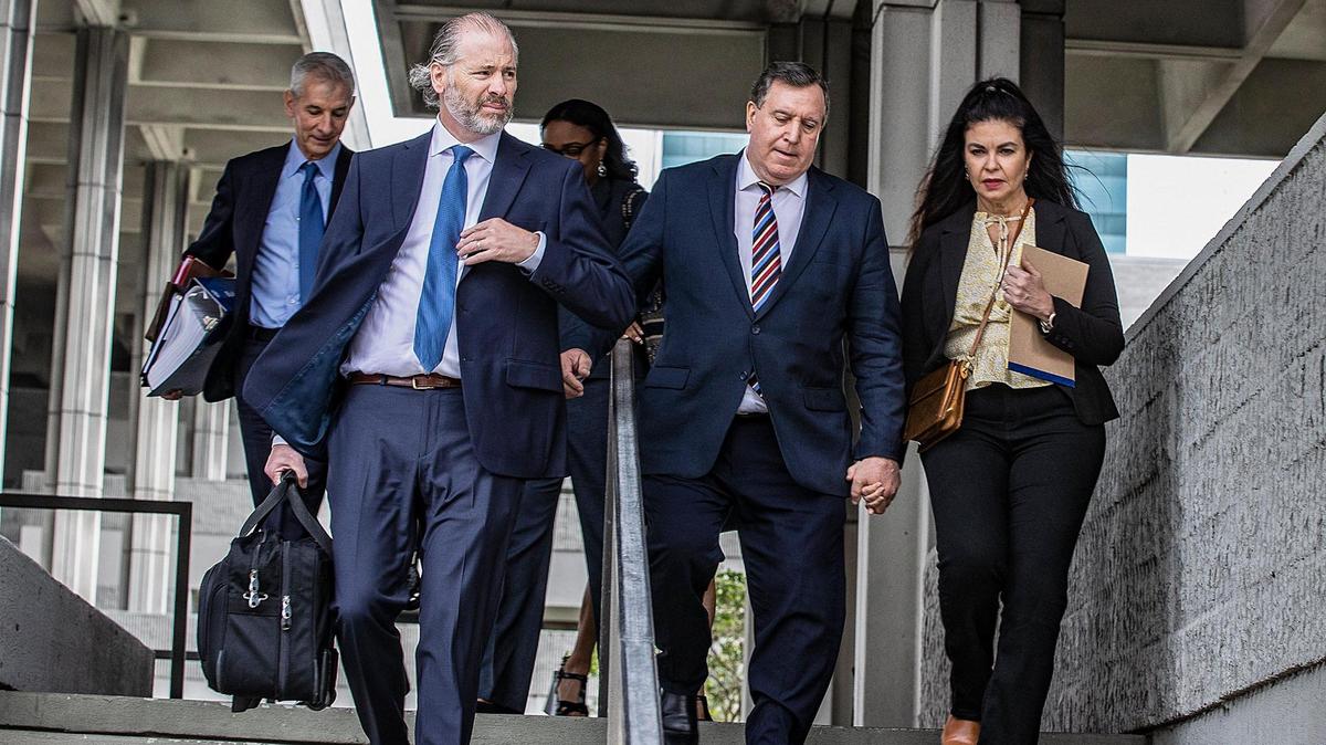 Miami Commissioner Joe Carollo is seen leaving federal court in Fort Lauderdale with his wife and two of his attorneys. Public records recently obtained by the Miami Herald show that Miami taxpayers have been footing the commissioner’s legal costs and so far have been billed almost $2 million.