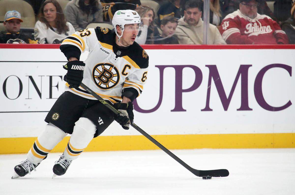 Mar 1, 2025; Pittsburgh, Pennsylvania, USA;  Boston Bruins left wing Brad Marchand (63) skates with the puck against the Pittsburgh Penguins during the first period at PPG Paints Arena.