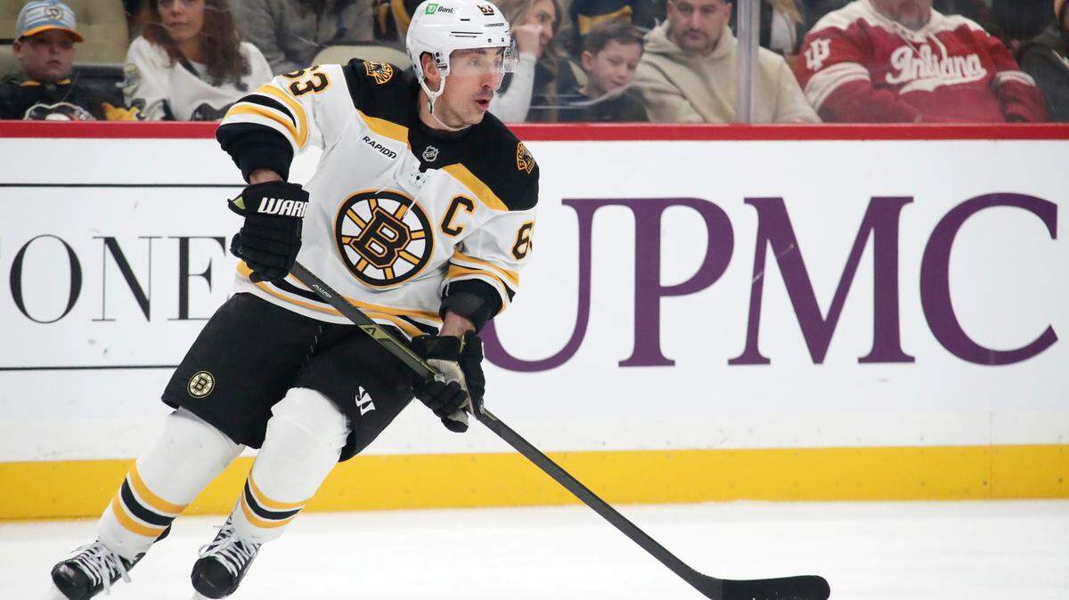 Mar 1, 2025; Pittsburgh, Pennsylvania, USA; Boston Bruins left wing Brad Marchand (63) skates with the puck against the Pittsburgh Penguins during the first period at PPG Paints Arena. Mandatory Credit: Charles LeClaire-Imagn Images