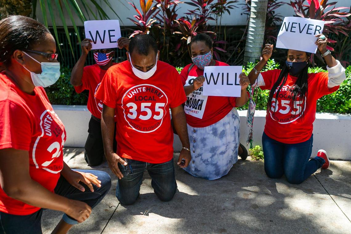 Jean Balan, center-left, participates in a National Strike for Black Lives protest outside of the Miami Beach City Hall on Monday, July 20, 2020.