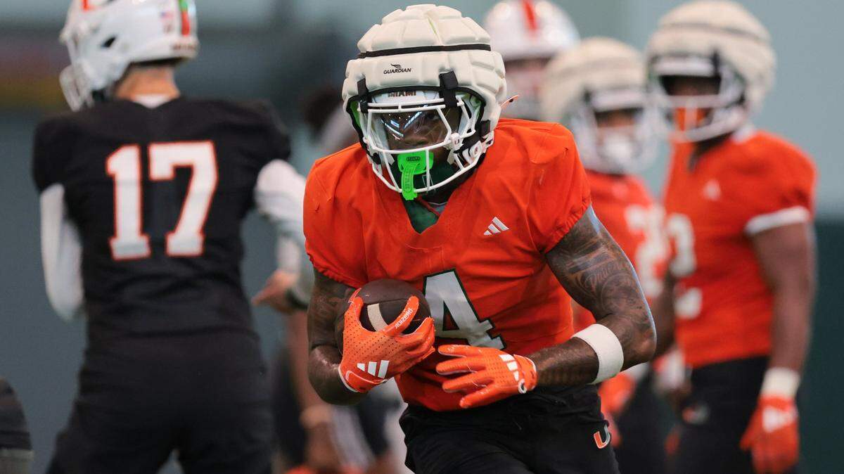 Miami Hurricanes running back Mark Fletcher Jr. (4) runs with the football during spring practice at the Carol Soffer Indoor Practice at the University of Miami in Coral Gables, Florida, Monday, March 3, 2025.