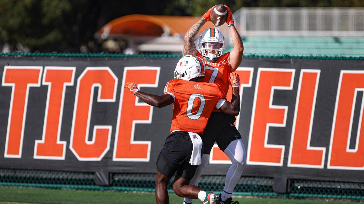 Hurricanes wide receiver Xavier Restrepo (7) catches the ball during a drill at he University of Miami Hurricanes football practice on Tuesday, March 21, 2023, at Greentree Field on campus in Coral Gables.