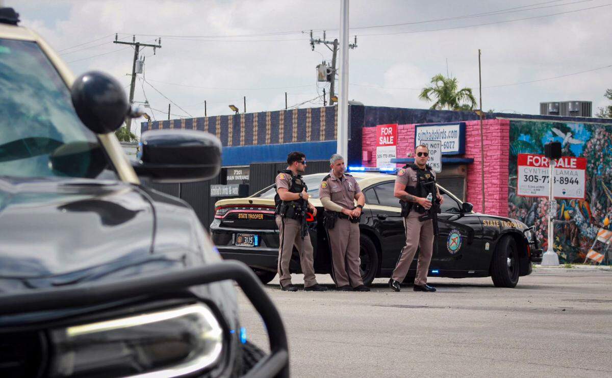 Miami, FL, April 24, 2025 - Deputies stand by as Miami-Dade Sheriff’s Office investigates a shooting near Southwest 75th Avenue and 45th Street, in the warehouse district south of Bird Road.