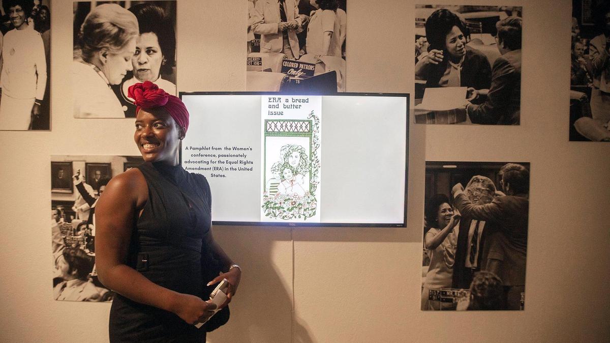 Taylor Patton, Development Officer with the Black Archives History and Research Foundation of South Florida looks at the photos during the opening of Gwen Cherry exhibit at the History Miami Museum, Downtown Miami, on March 28th., 2024.