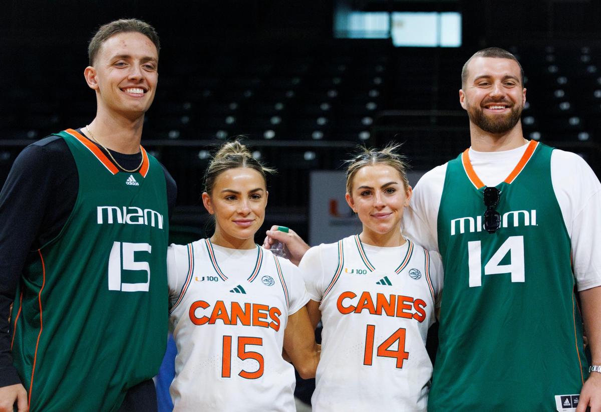 Miami Hurricanes guard Hanna Cavinder (15) and her sister guard Haley Cavinder (14) pose for a photo with thier boyfriends Carson Beck, left, Hurricanes quarterback and Jake Ferguson, NFL tight ed, after winning a basketball game against the Wake Forest Demon Deacons on Sunday, Feb. 23, 2025, at Watsco Center in Coral Gables, Fla.