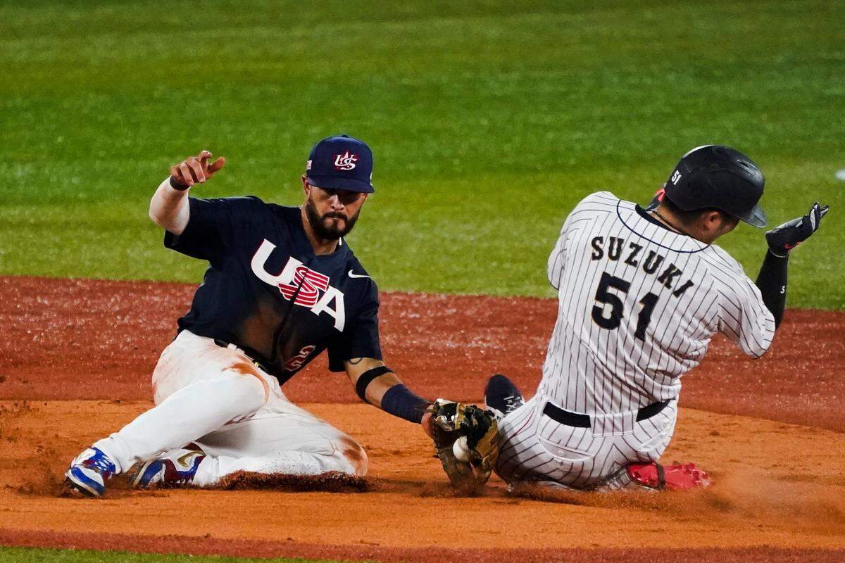 Japan’s Seiya Suzuki (51) is tagged out by United States’ Eddy Alvarez attempting to steal second during the gold medal baseball game at the 2020 Summer Olympics, Saturday, Aug. 7, 2021, in Yokohama, Japan.