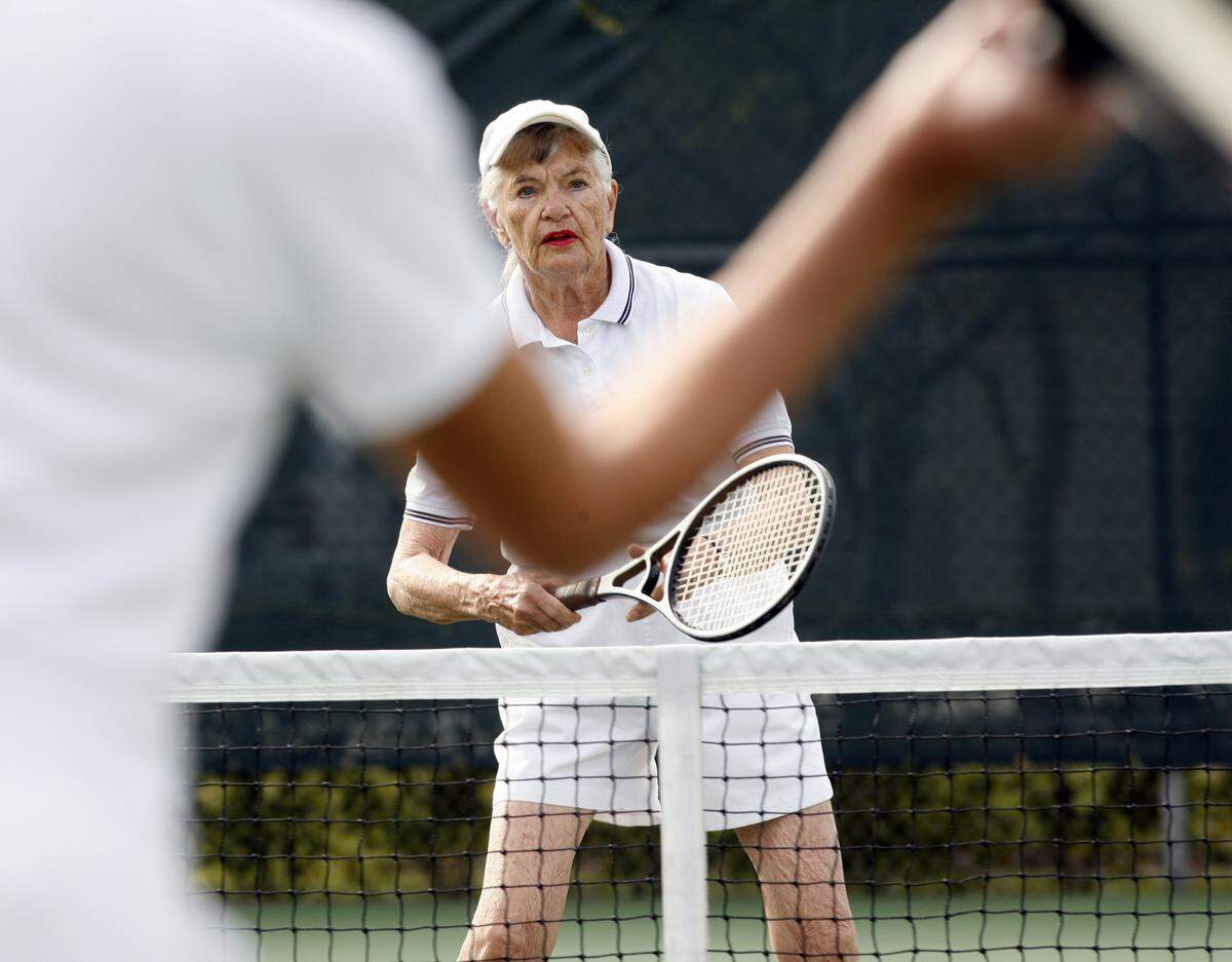In this Feb. 9, 2007 file photo for a Miami Herald fitness column, Jean Pugh, then-84, played tennis at Coral Pine Park in Pinecrest “.I’ve been playing tennis since I was in high school, but that doesn’t mean I’m good. I just enjoy the game,” she told the Herald at the time.