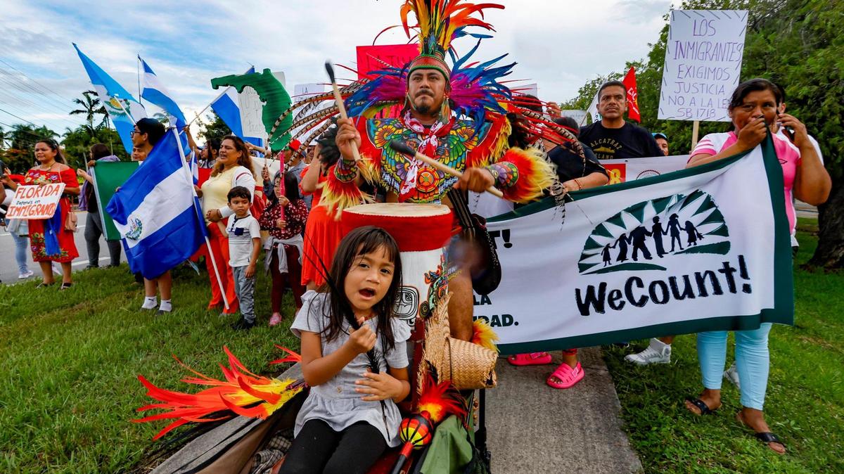 Luna Marin, 4, rides a cart pushed by her father Francisco Marin as he beats the drum during a march along US1 for a “Freedom For All” rally in Homestead, Florida, as they protest against the bills passed by the Florida Legislature and signed into law by Gov. Ron DeSantis on Saturday, July 1, 2023.