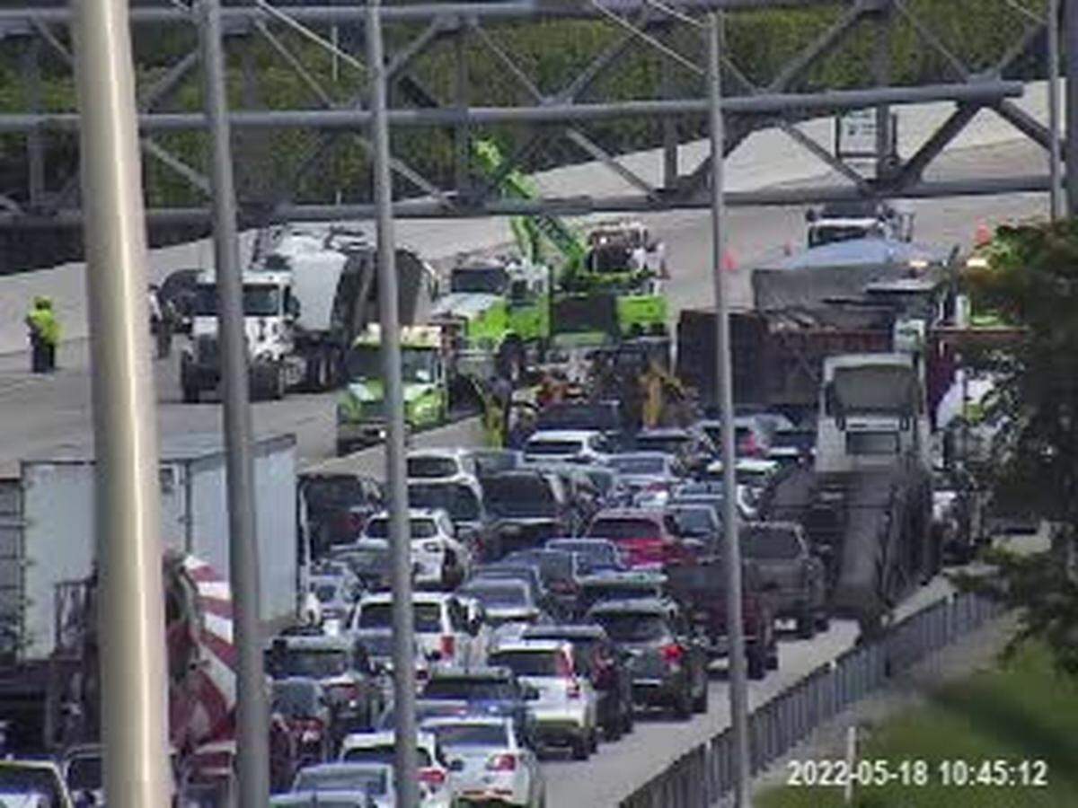 Traffic remained clogged at 10:45 a.m. as the Florida Turnpike was shut down in both directions after the rollover crash.