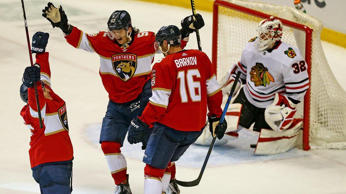 Florida Panthers Frank Vatrano (77) scores the winning goal in overtime as MacKenzie Weegar (52) leaps in joy as they defeat the Chicago Blackhawks at the BB&T Center in Sunrise, Florida, Tuesday, January 19, 2021.