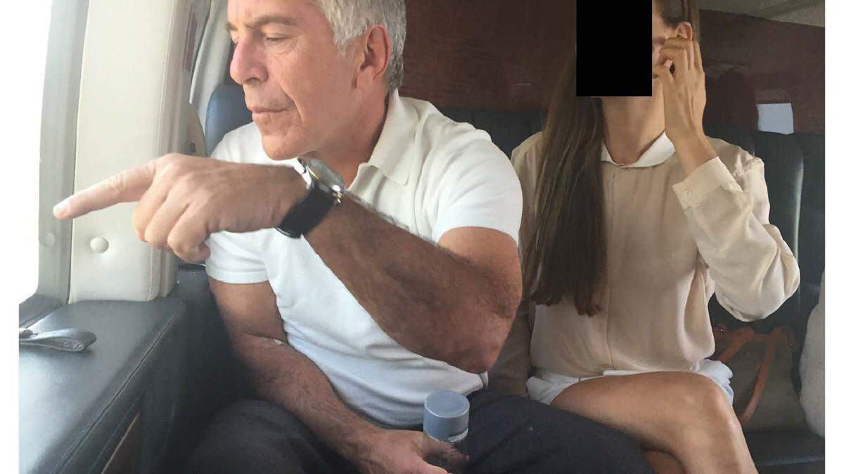 Jeffrey Epstein sits on a plane next to a woman whose face is blacked out in this undated photo released by the late financier’s estate to the House Oversight Committee, which made additional documents public on Dec. 18, 2025.