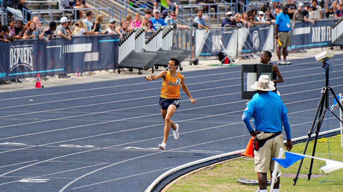 Belen Jesuit’s Marcelo Mantecon crosses the finish line on Saturday after winning his race and helping the Wolverines secure their first state team track and field title since 2007.