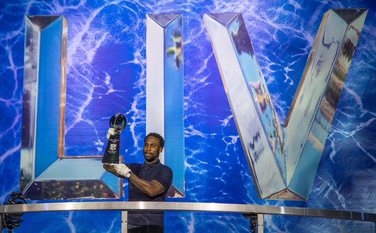 FedEx and 14-year veteran, Anquan Boldin, delivers the Vince Lombardi Trophy to Miami for display during the Super Bowl Experience in the Miami Beach Convention Center on Miami Beach, Saturday, January 25, 2020.