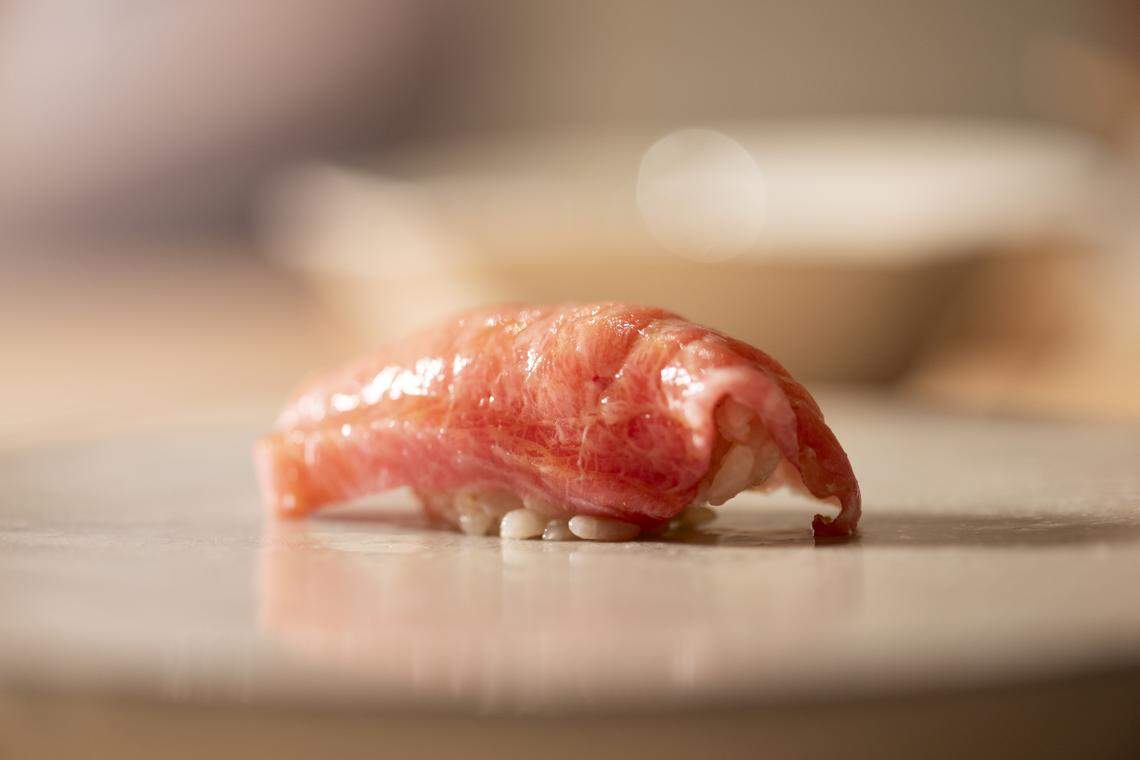 A piece of otoro tuna, the fattiest and most premium cut of blue fin tuna belly at Yasu Omakase.