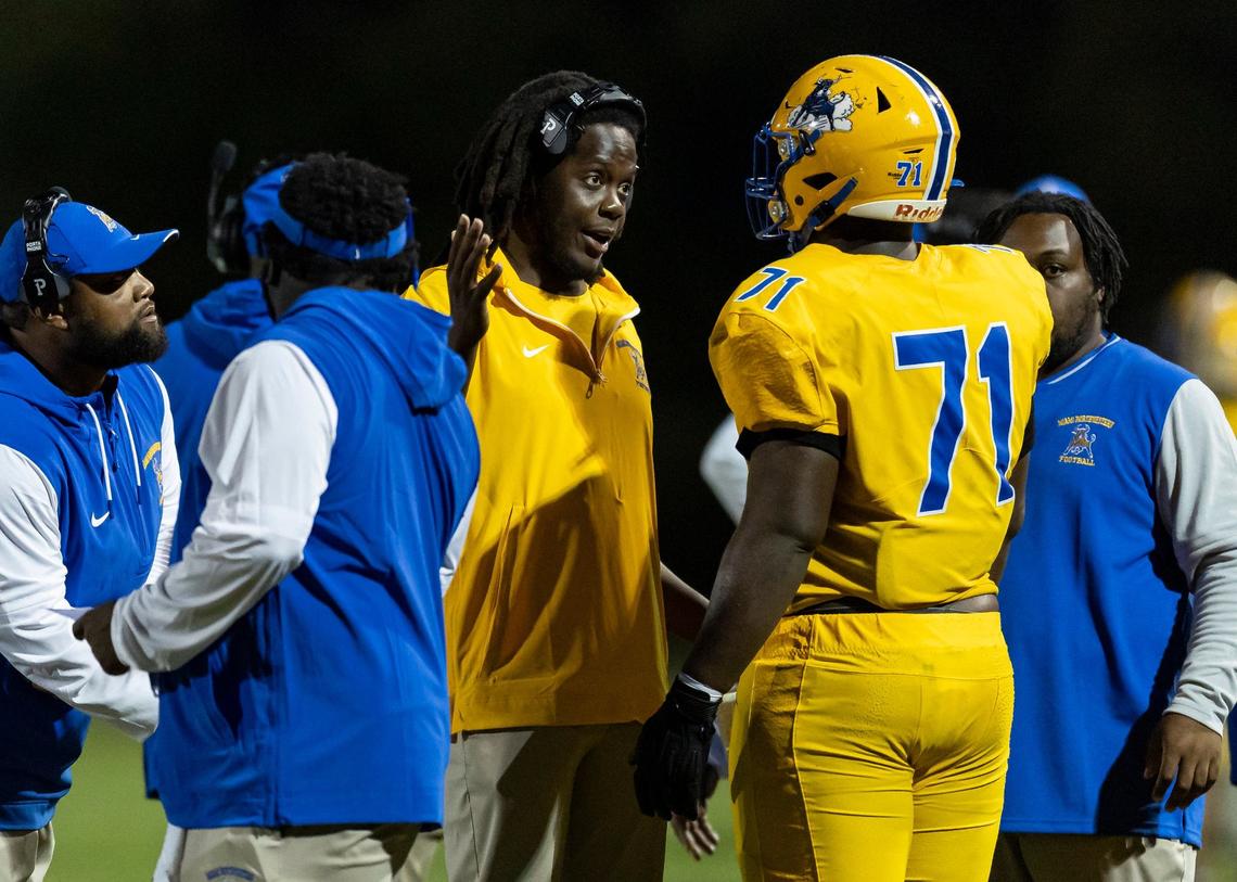 Miami Northwestern Bulls head coach Teddy Bridgewater talks with offensive tackle Anthony Bell (71) in the first half of their football game against the Coconut Creek Cougars at Coconut Creek High School on Thursday, Aug. 22, 2024.