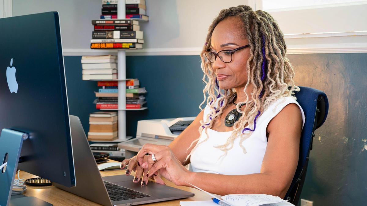 South Florida People of Color founder Roni Bennett works from her home office on Friday, Oct. 30, 2024, in Miami.