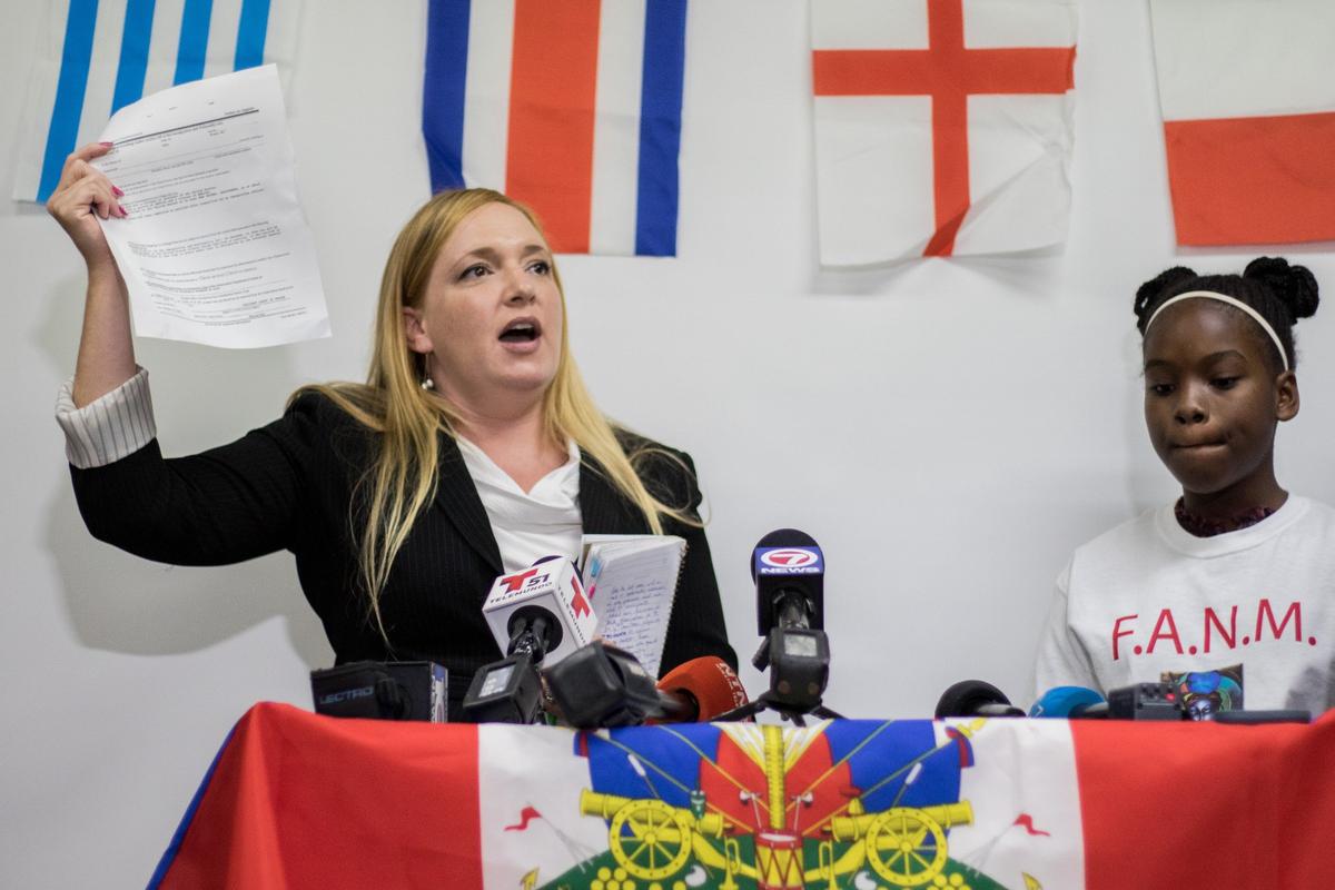 Immigration attorney Adonia Simpson of Americans for Immigrant Justice urges President Trump to find a permanent solution for TPS during a press conference at Family Action Network Movement (FAMN) in Miami, Tuesday, July 24, 2018. In one year, the termination of TPS for Haiti will become effective.
