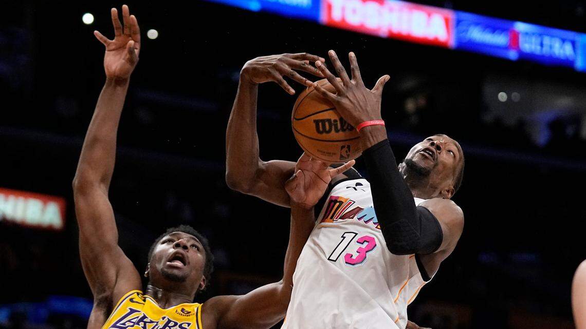 Miami Heat center Bam Adebayo, right, grabs a rebound away from Los Angeles Lakers center Thomas Bryant during the second half of an NBA basketball game Wednesday, Jan. 4, 2023, in Los Angeles.