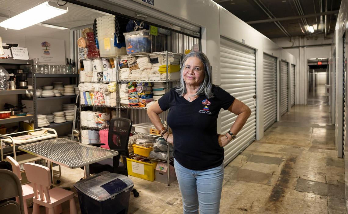 Patricia Andrade, the president of Raíces Venezolanas Miami, is photographed in front of one of the three storage units from which she runs her nonprofit, on Friday, April 11, 2025, in Doral, Fla. She helps newly arrived Venezuelans by providing guidance and distributing basic items to help them start their lives in the United States.
