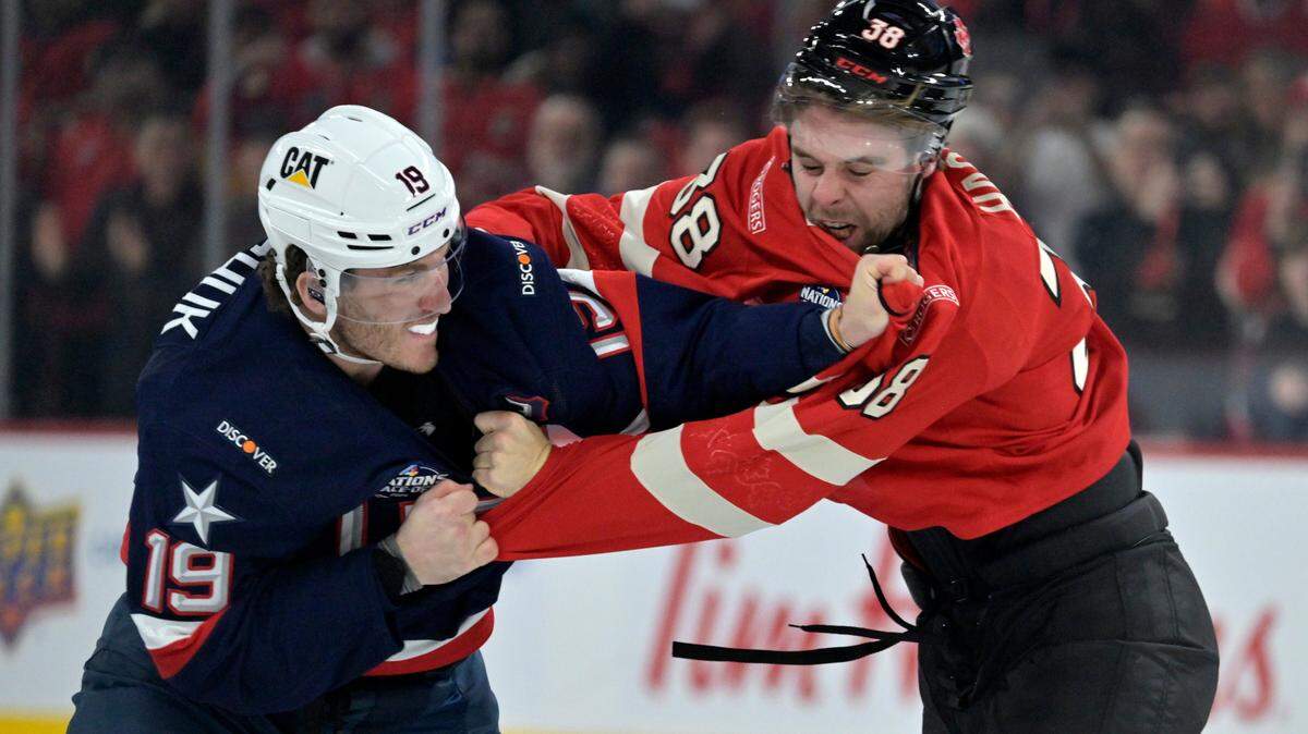 Feb 15, 2025; Montreal, Quebec, CAN; Team United States forward Matthew Tkachuk (19) and Team Canada forward Brandon Hagel (38) fight in the first period during a 4 Nations Face-Off ice hockey game at the Bell Centre.