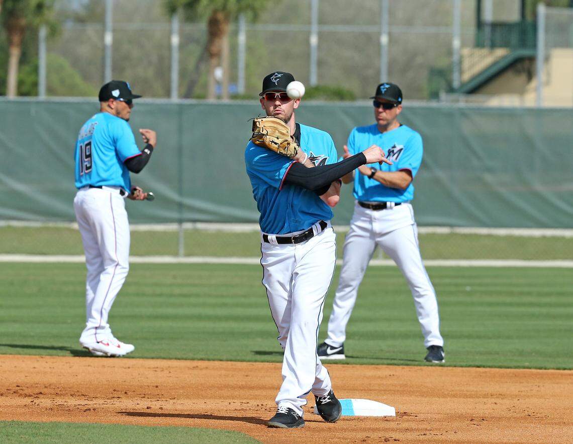 Miami Marlins infielder JT Riddle (10) throws to first base during the first full-squad spring training workout on Monday, February 18, 2019 in Jupiter, FL.