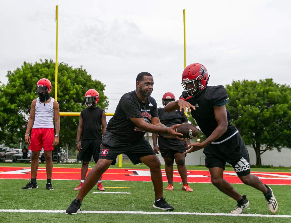 Miami Edison football coach Luther Campbell runs drills with his players during a practice session at their school’s field in Miami’s Little Haiti neighborhood on Tuesday, September 7, 2021.