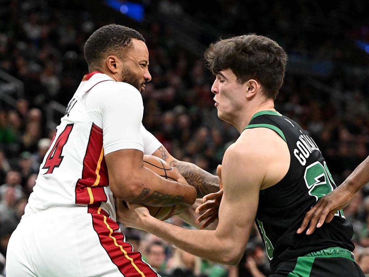 Hugo Gonzalez #28 of the Boston Celtics and Norman Powell #24 of the Miami Heat battle for the ball during the second half at the TD Garden on February 06, 2026 in Boston, Massachusetts.