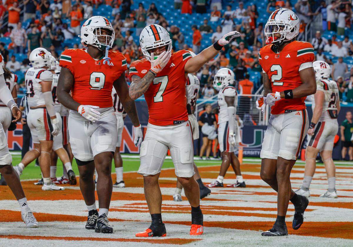Miami Hurricanes wide receiver Xavier Restrepo (7) celebrates in the end zone with teammates after scoring in the first half of an NCAA football game against the Ball State Cardinals at Hard Rock Stadium in Miami Gardens, Florida on Saturday, September 14, 2024.