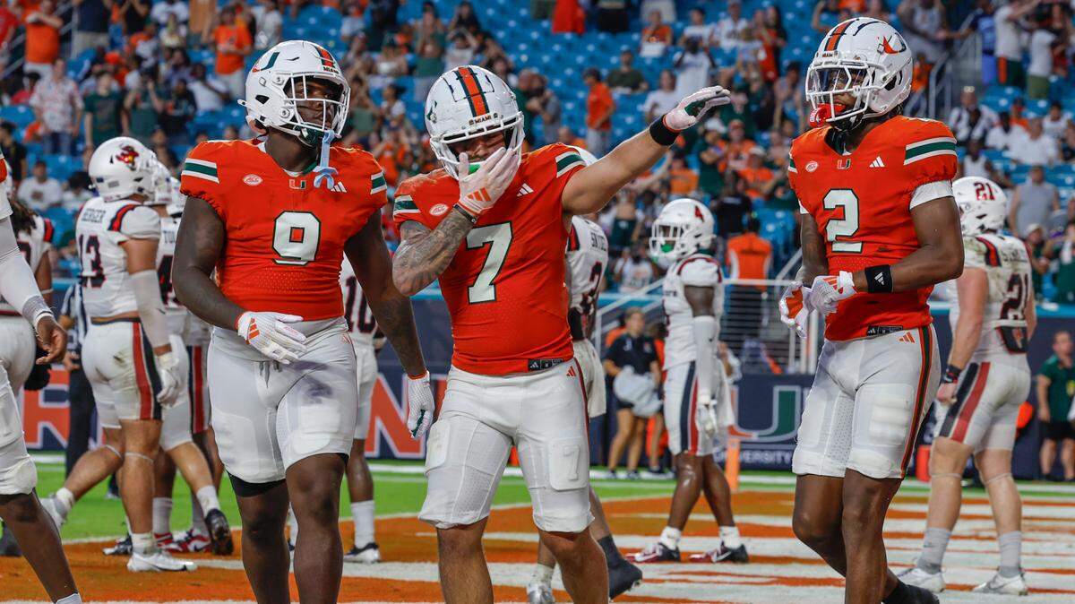 Miami Hurricanes wide receiver Xavier Restrepo (7) celebrates in the end zone with teammates after scoring in the first half of an NCAA football game against the Ball State Cardinals at Hard Rock Stadium in Miami Gardens, Florida on Saturday, September 14, 2024.