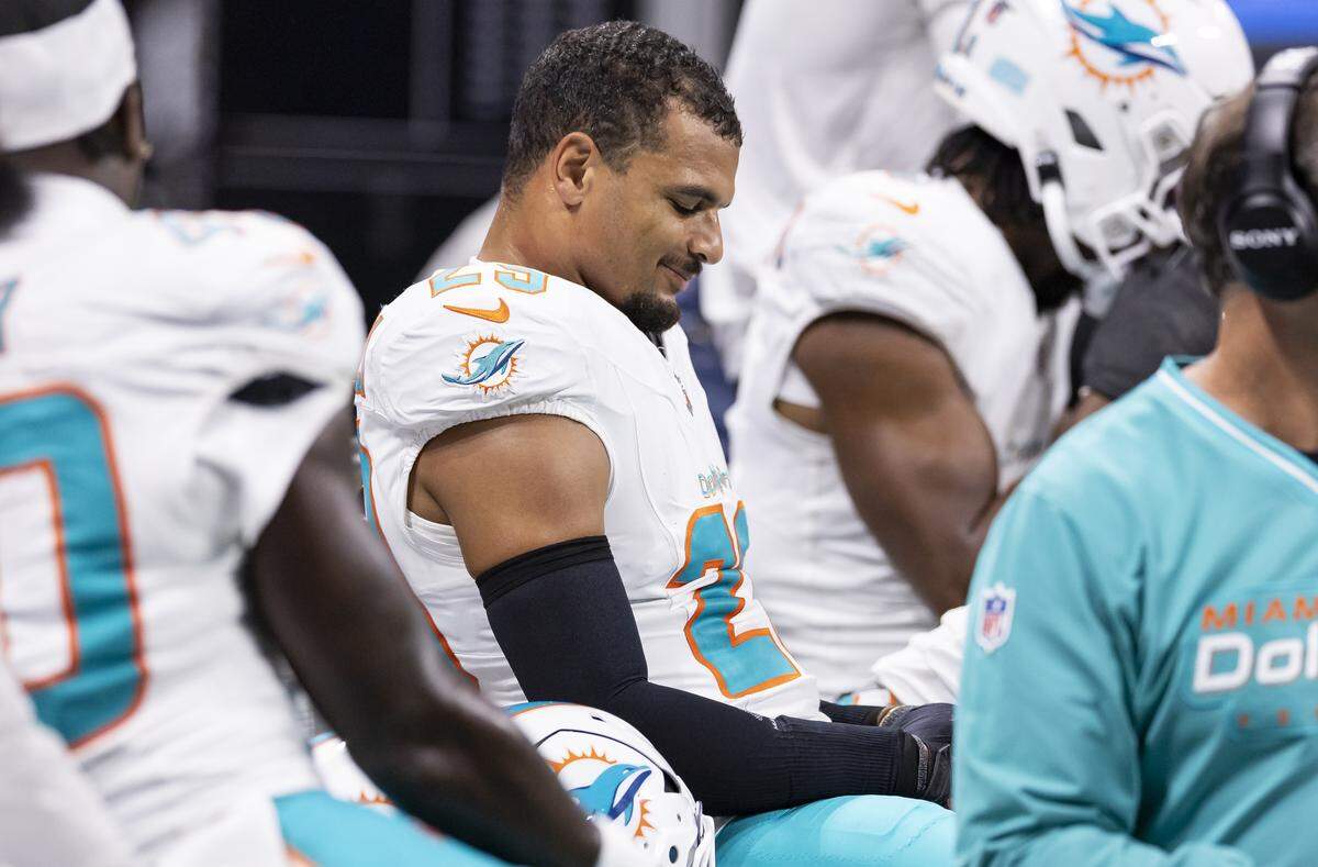 Miami Dolphins safety Minkah Fitzpatrick (29) looks on from the bench after sustaining an injury during a play against the Atlanta Falcons in the second half of their NFL game at Mercedes-Benz Stadium on Sunday, Oct. 26, 2025, in Atlanta, Ga.