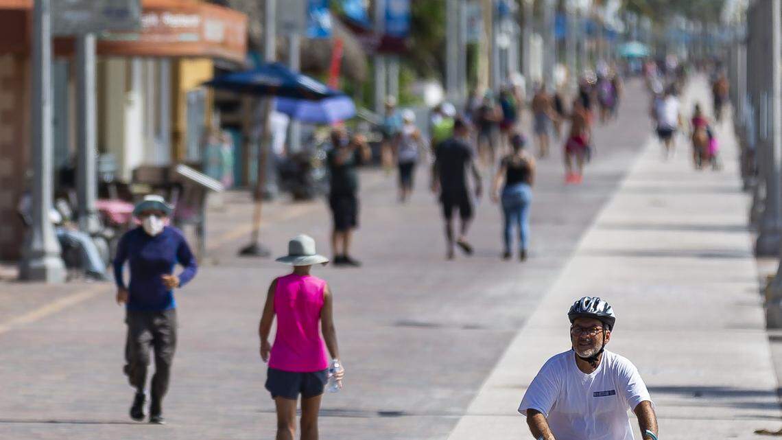 The average occupancy rates dropped by 0.3% for outdoor shopping centers in Broward. Above: Beach goers make their way down the Hollywood Beach Broadwalk on Tuesday, May 26, 2020.