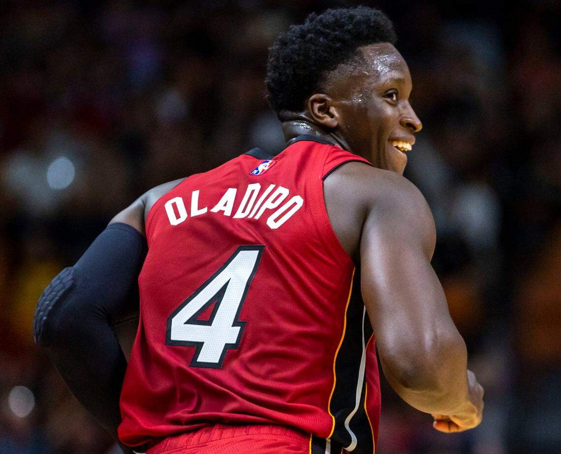 Miami Heat guard Victor Oladipo (4) reacts after scoring against the Houston Rockets during the first quarter of an NBA game at FTX Arena in Downtown Miami, Florida, on Monday, March 7, 2022.