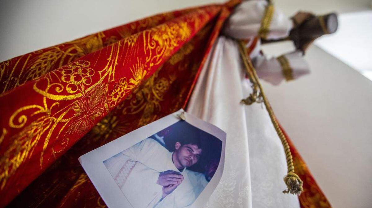 An image of Bishop Rolando Alvarez is pinned to a robe on a statue of Jesus Christ at the Cathedral in Matagalpa, Nicaragua in 2022. Police raided his residence, detaining him and several other priests.