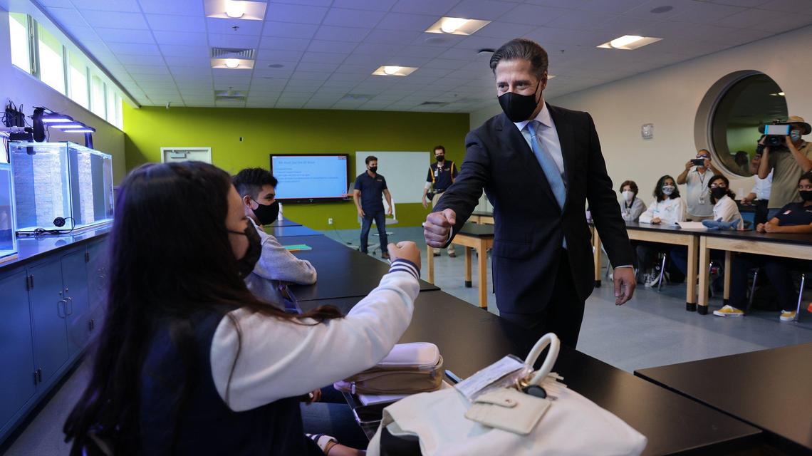 Miami-Dade Schools Superintendent Alberto Carvalho welcomes students with fist bumps as they return to on-site learning while visiting an AP environmental science class at the new MAST Academy at FIU’s Biscayne Bay Campus on Monday, Aug. 23, 2021, the first day of school for Miami-Dade Schools. Students, faculty, staff and visitors were required to wear masks inside the school, based on a vote last week by the Miami-Dade School Board.