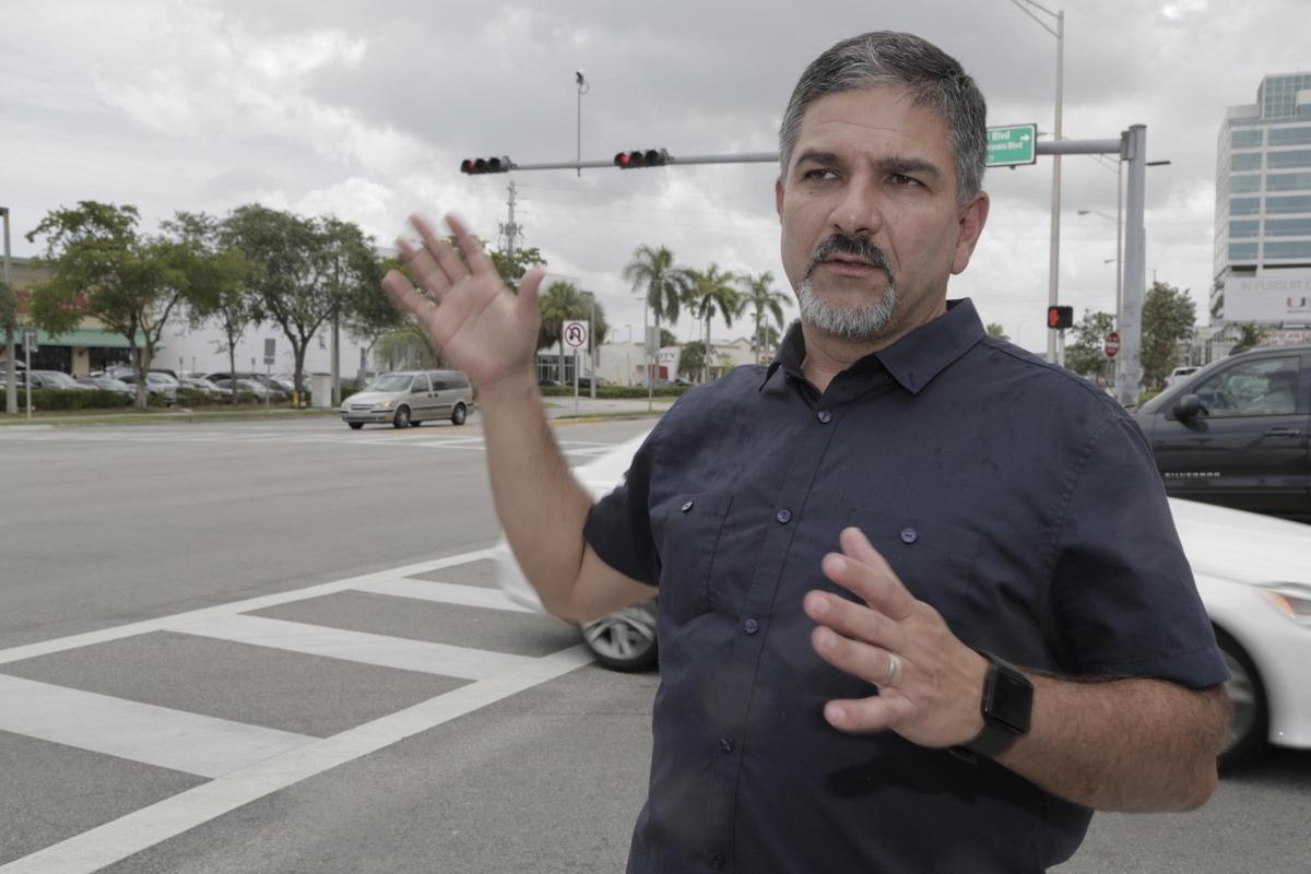 Frank Aira, chief of Miami-Dade's Traffic Signals & Signs Division, explains how new “smart” lights will work on U.S. 1.  On Monday, Miami-Dade will flip on its devices on the busy highway so that computers control the pace of green lights.  Cameras will calculate traffic flow, allowing the computer to tweak timing in an effort to send “platoons” of cars from one green light to another.