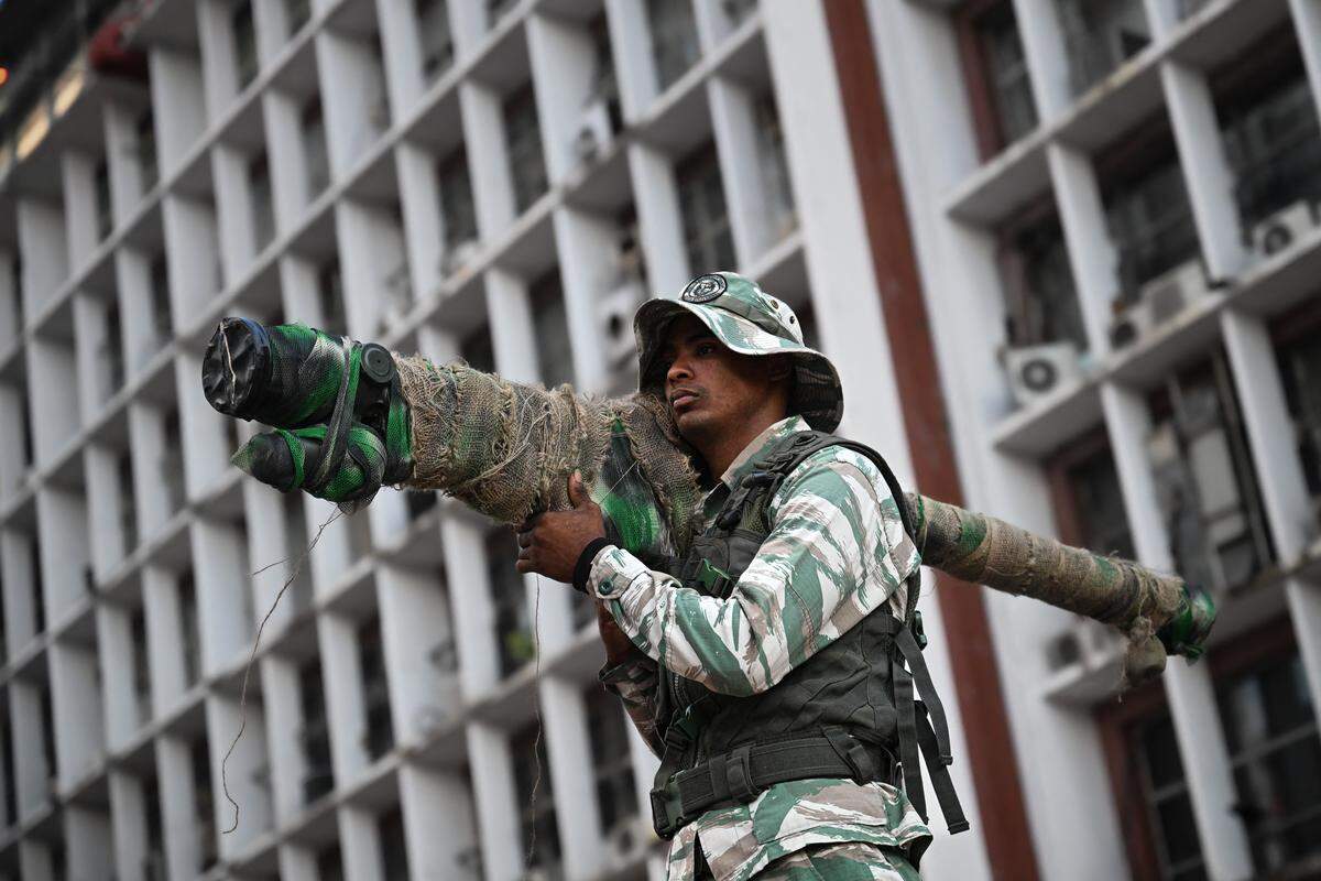 A member of the Bolivarian National Militia holds a Russian-made 9K338 "Igla-S" (SA-18) portable air-defense (MANPAD) surface-to-air missile launcher as he takes part in a rally against U.S. military activity in the Caribbean, in Caracas on Oct. 30, 2025.           