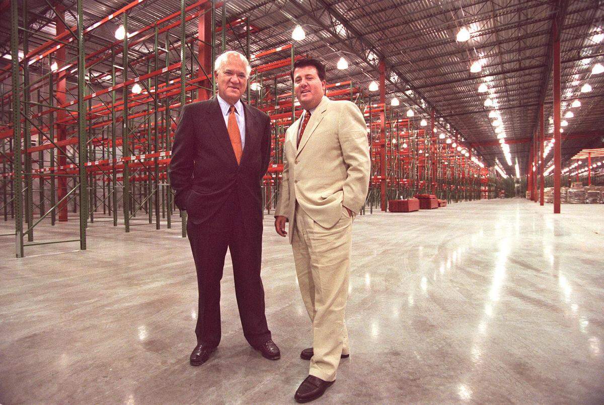File photo from Aug. 20, 1997, of George Feldenkreis and his son Oscar Feldenkreis of Supreme International clothing manufacturers. The Miami company acquired Perry Ellis and they are seen here in a then new 200,000-square-foot plant that was being built for its headquarters.