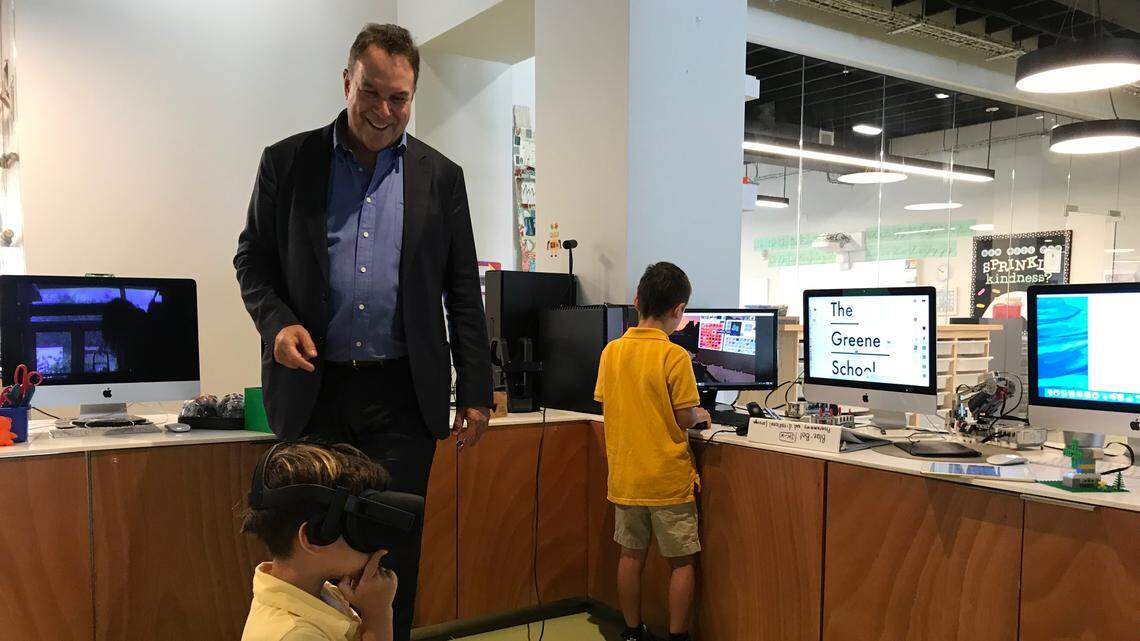 Jeff Greene’s sons Cameron, 4, and Brandon, 6, show off the virtual-reality gadgets at The Greene School on Aug. 13. Through the technology, they can virtually visit locations across the globe via Google Earth.  Greene, a Democratic candidate for governor, opened the school with his wife in 2016.