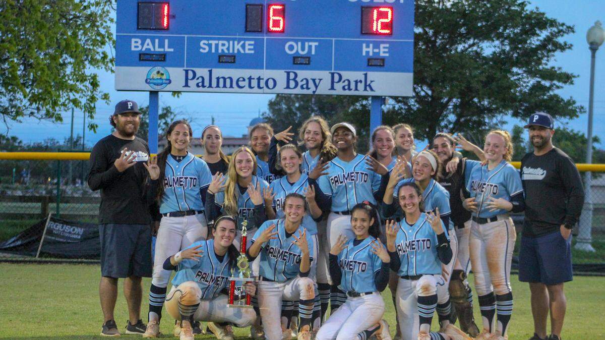 Palmetto players hold up four fingers proudly following their 12-1 rout of Coral Reef in Wednesday’s GMAC final at Palmetto Bay Park as it marked the Panthers fourth consecutive GMAC championship.