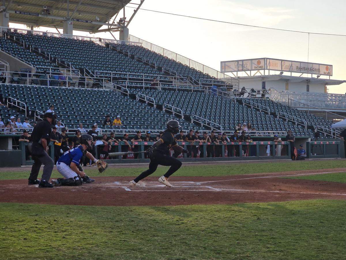 American Heritage’s Jordan Rich hits a first-inning infield single during Monday night’s Class 4A state semifinal at Hammond Stadium in Fort Myers, Fla.