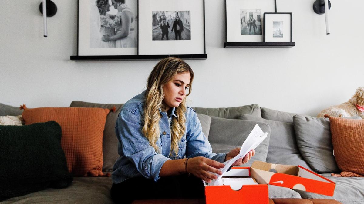Nicolette Solomon looks through letters from her former students at her home in Miami.