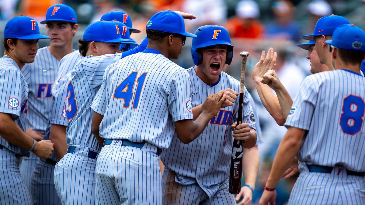 University of Florida base runner Colby Halter (5) reacts after scoring off Deric Fabian double during the first inning of an NCAA baseball game against University of Miami inside Alex Rodriguez Park at Mark Light Field in Coral Gables, Florida, on Sunday, March 6, 2022.