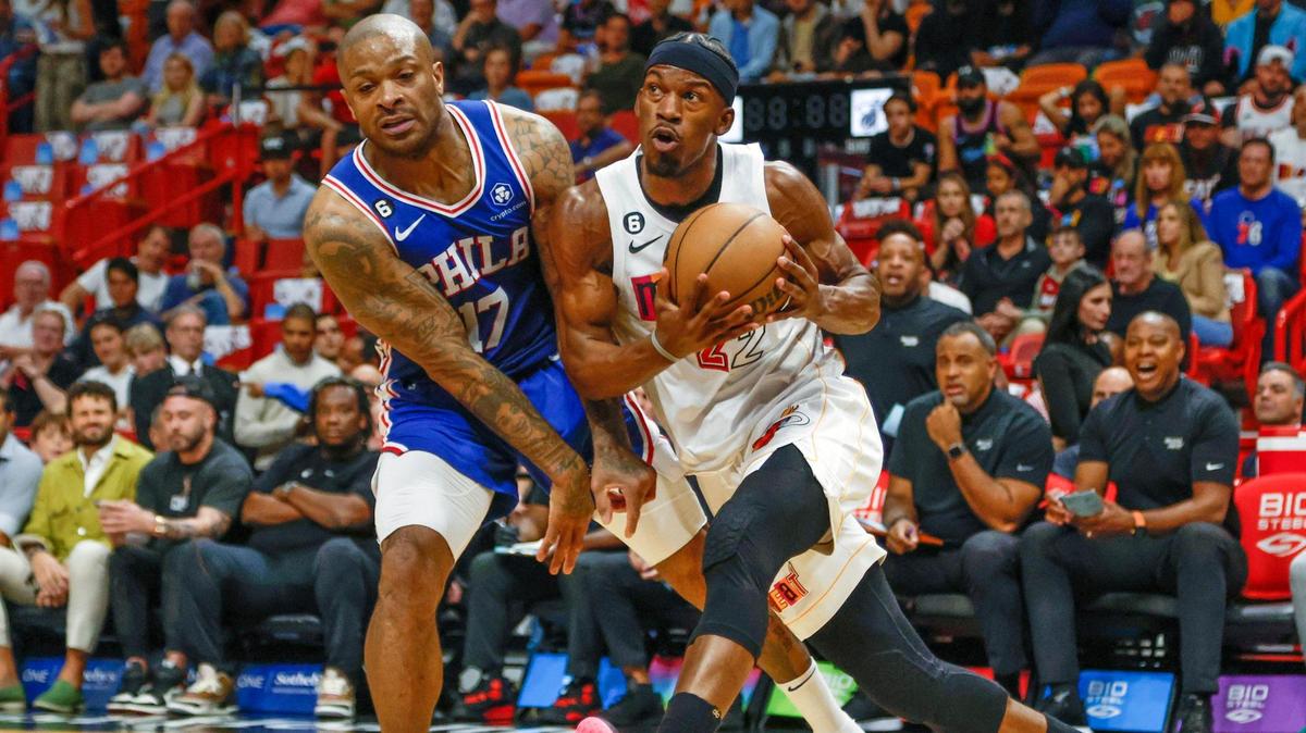 Miami Heat forward Jimmy Butler (22) drives to the basket as Philadelphia 76ers forward P.J. Tucker (17) defends in the first quarter at Miami-Dade Arena in Miami, Florida on Wednesday, March 1, 2023.