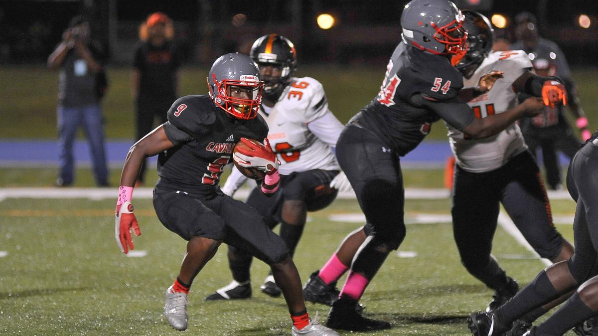 Running back Troy Davis of The Coral Gables Cavaliers runs the ball against Booker T Tornados in the second quarter of their high school football game in MIami, Fla on Friday, Oct. 5th, 2018. Tornados beat the Cavaliers 26-21.