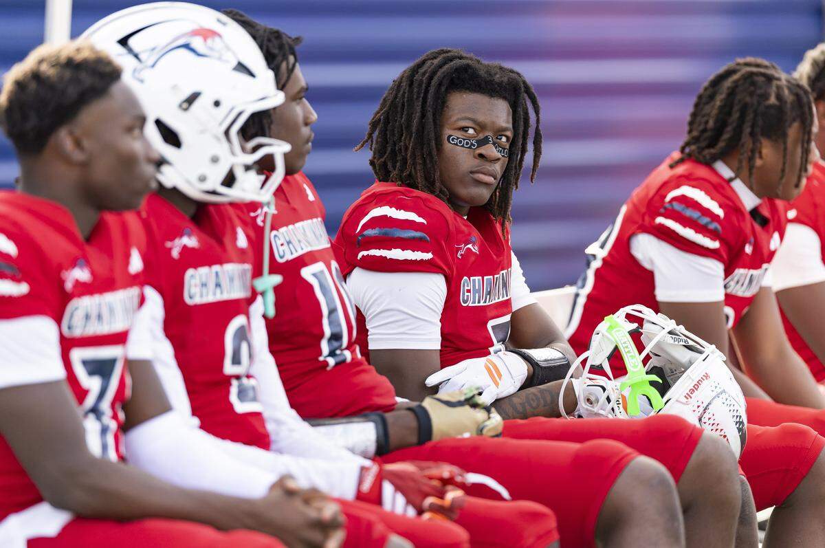 Chaminade-Madonna Lions running back Arwin Jackson (2) looks on from the bench as his team plays against the Cardinal Newman Crusaders in the second half of their Class 1A state championship football game at Pitbull Stadium on Thursday, Dec. 11, 2025, in Miami, Fla.